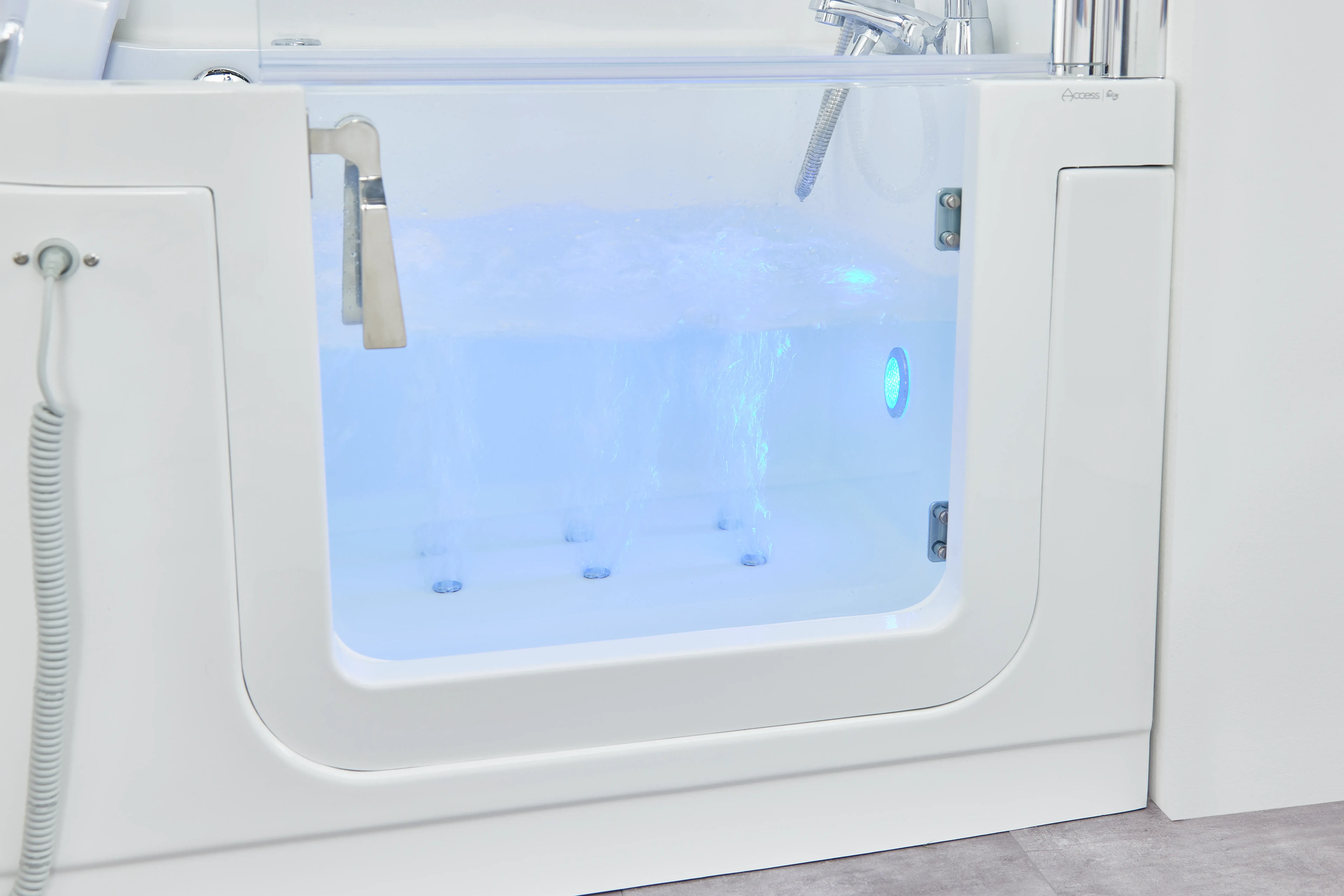 A white bath tub with a light inside of it.